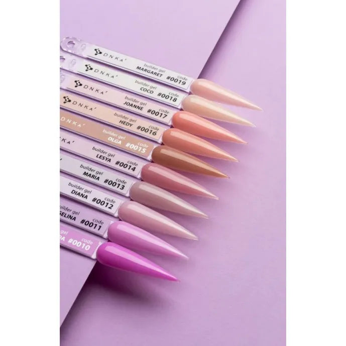 Assorted nude and pink builder gel nail polish samples displayed on swatch sticks