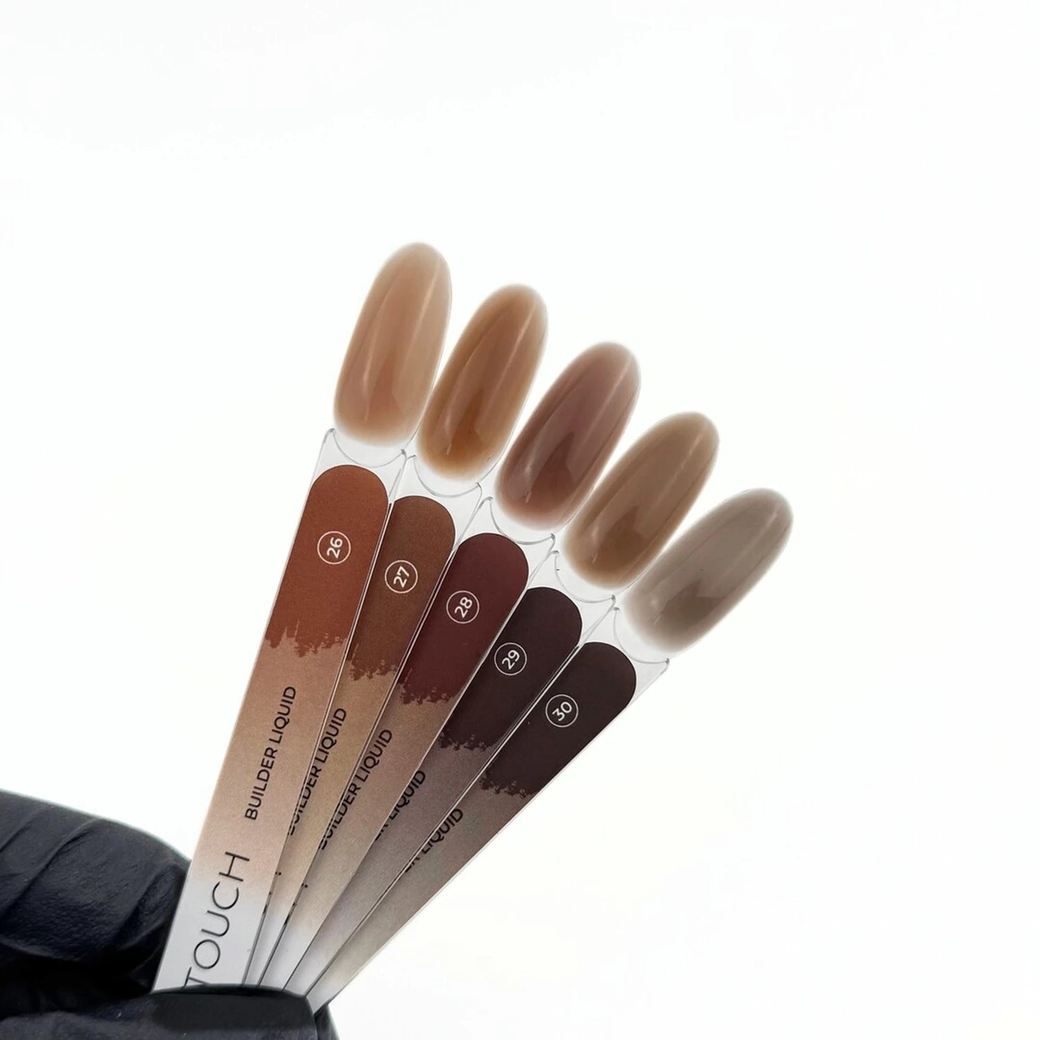 Five nude and brown nail polish gel swatches for professional manicure