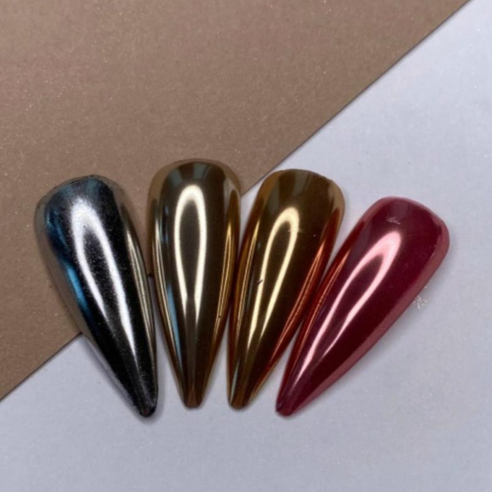 Set of four metallic chrome nail polish swatches in silver, gold, bronze, and red shades