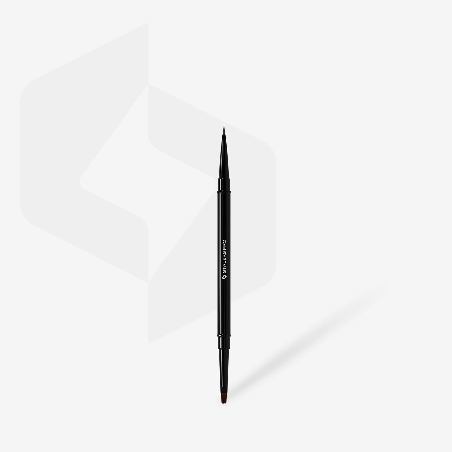 Dual-ended nail art brush for manicure and gel application on white background
