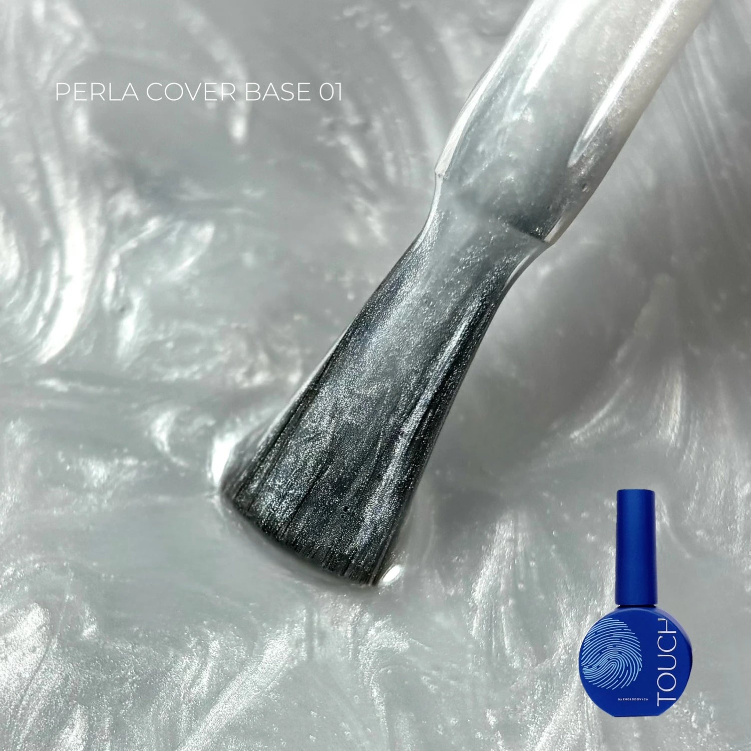Pearlescent nail polish gel base with brush applicator and blue bottle, close-up
