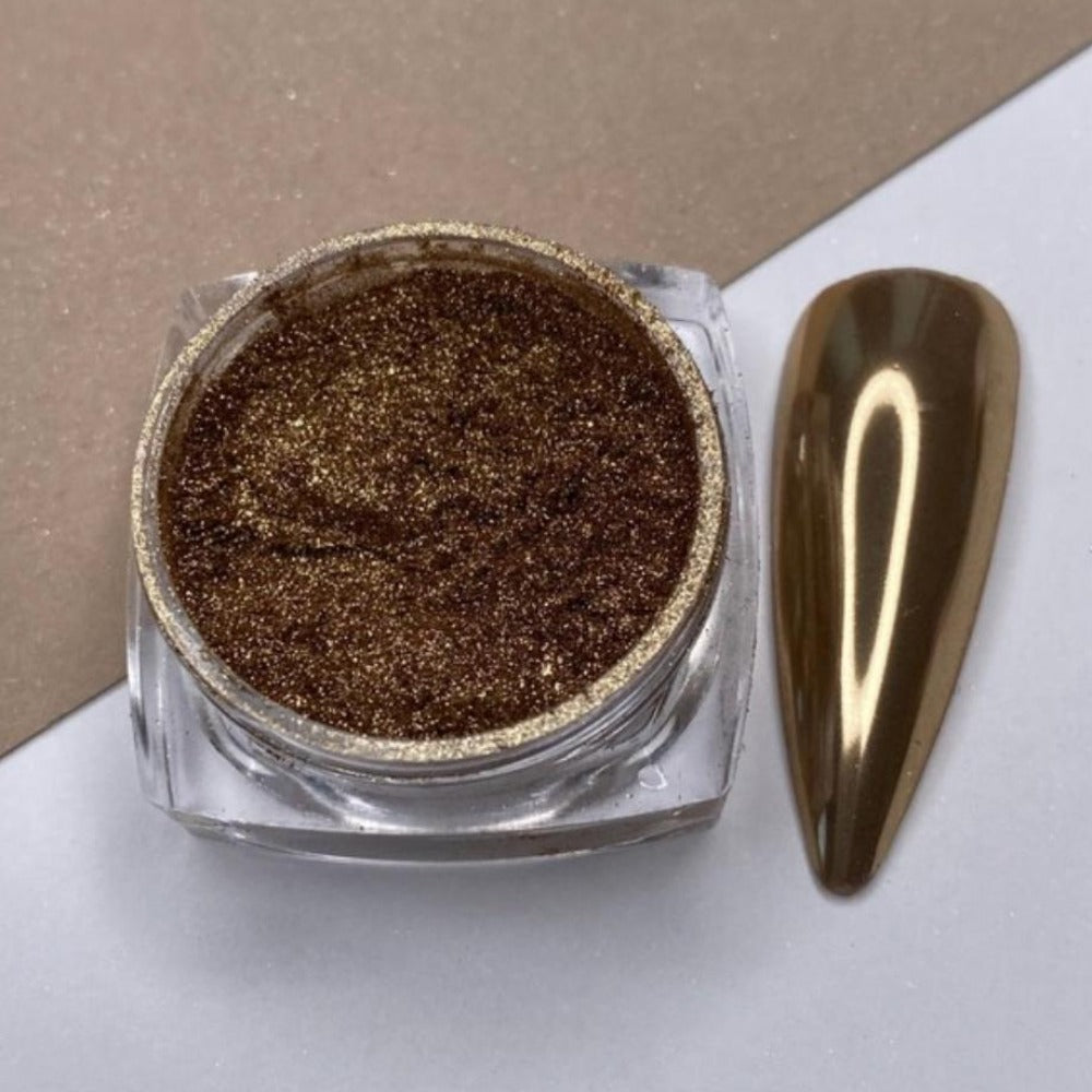 Gold chrome nail powder in a clear jar with matching metallic nail tip sample