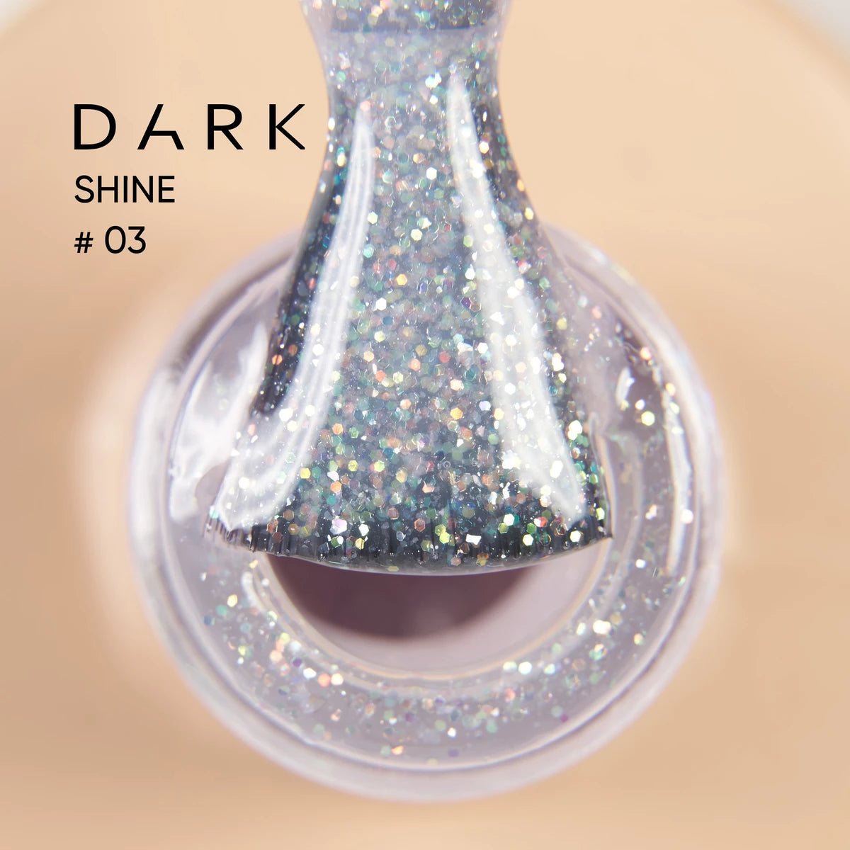 Close-up of glittery gel nail polish brush labeled Dark Shine #03