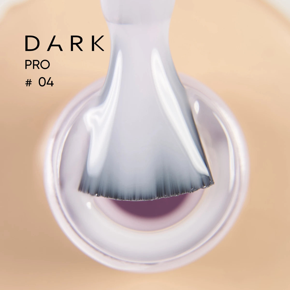 Close-up of a nail polish brush with sheer gel polish, labeled Dark Pro #04.