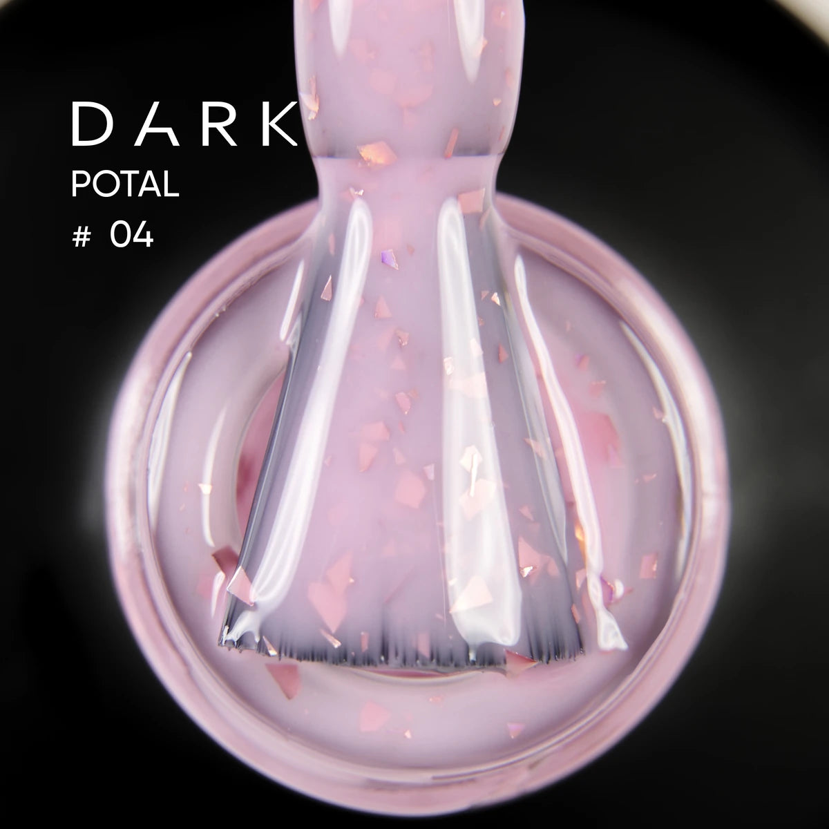 Close-up of pink UV gel nail polish with shimmer flakes and application brush