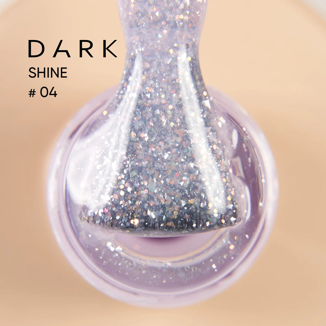 Close-up of sparkly glitter UV gel nail polish brush with silver shimmer in bottle, labeled Dark Shine 