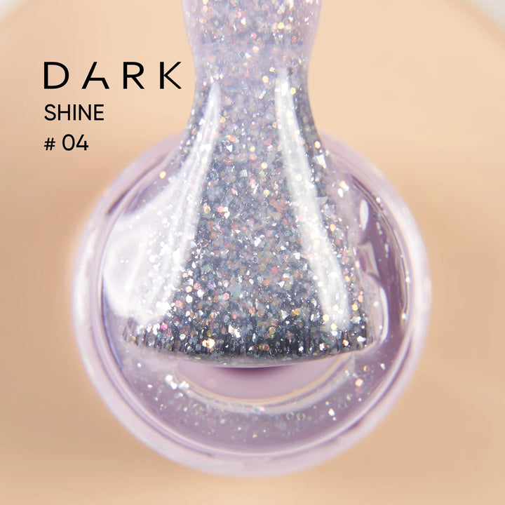 Close-up of sparkly glitter UV gel nail polish brush with silver shimmer in bottle, labeled Dark Shine 