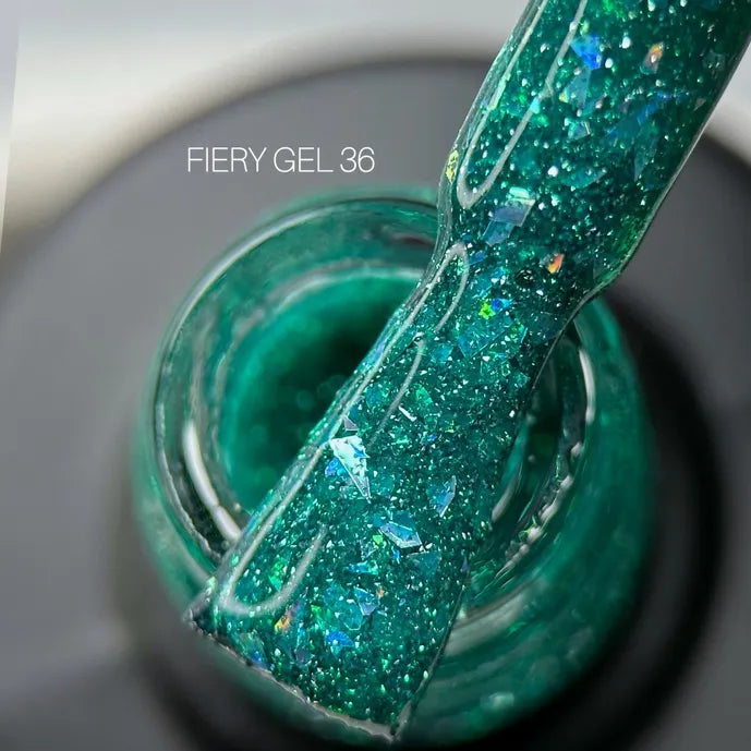 Green glitter UV gel nail polish, close-up of brush and jar, labeled FIERY GEL 36