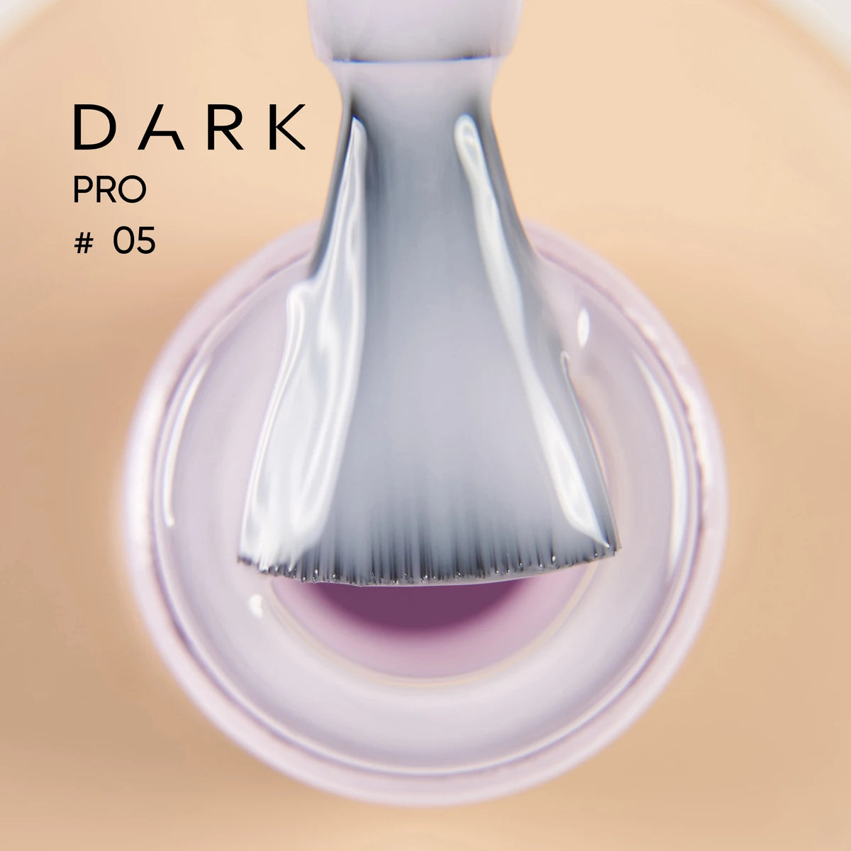 Close-up of a brush applying light purple nail gel polish, labeled Dark Pro #05