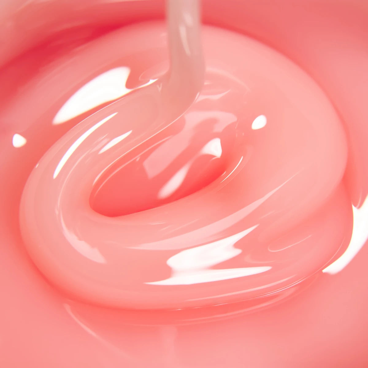 Close-up of pink builder gel for nails, glossy texture, nail art product