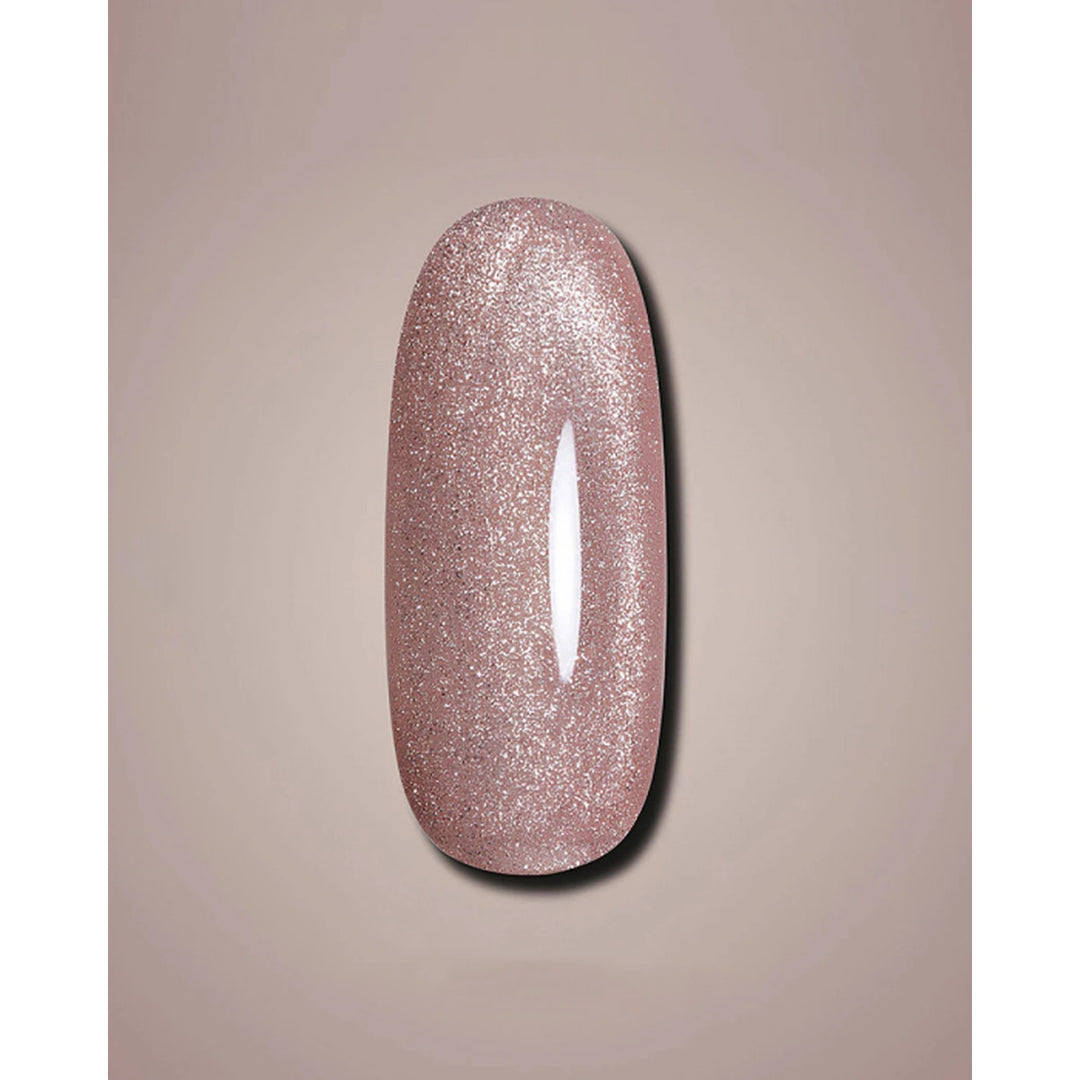 A glossy, glittery nail polish swatch in a dusty rose pink color, displayed on a neutral beige background.