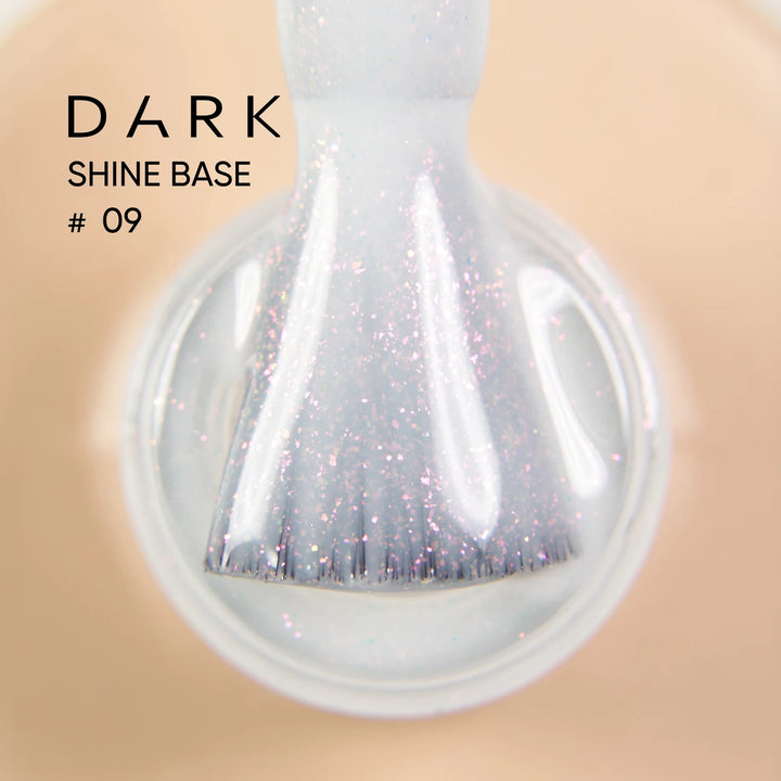 Iridescent pink glitter gel nail polish brush in bottle, labeled Dark Shine Base 