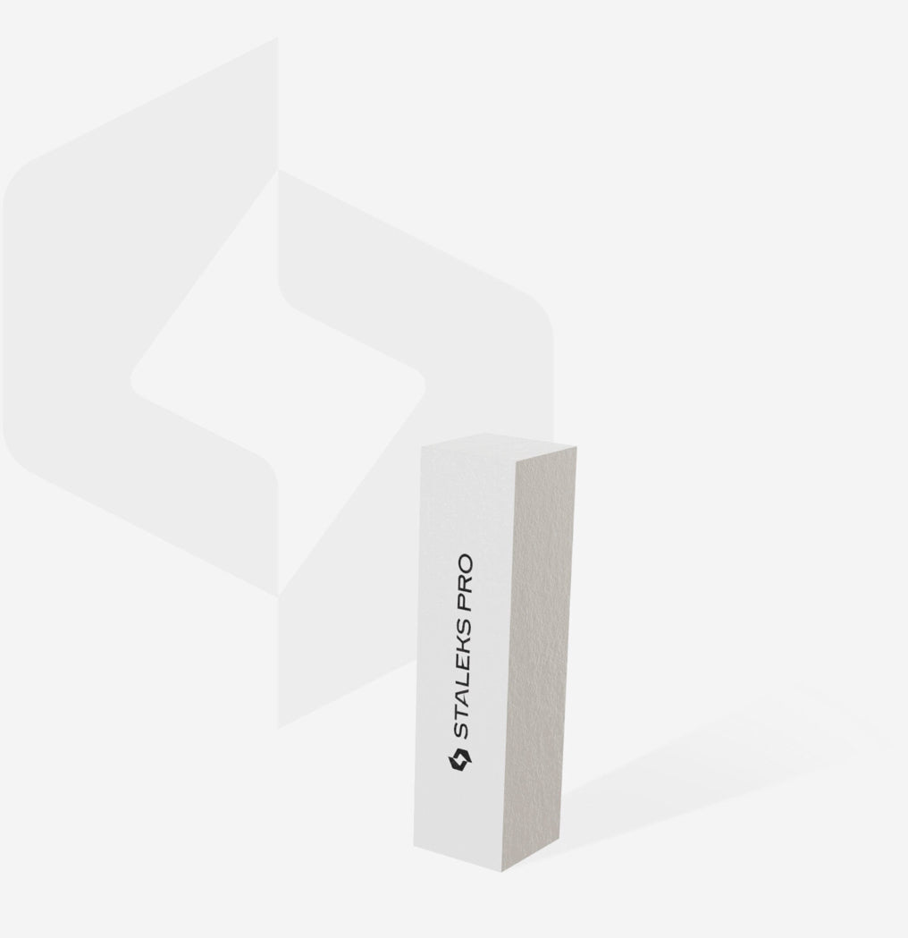 White nail buffer block with STALEKS PRO logo on clean background, manicure tool
