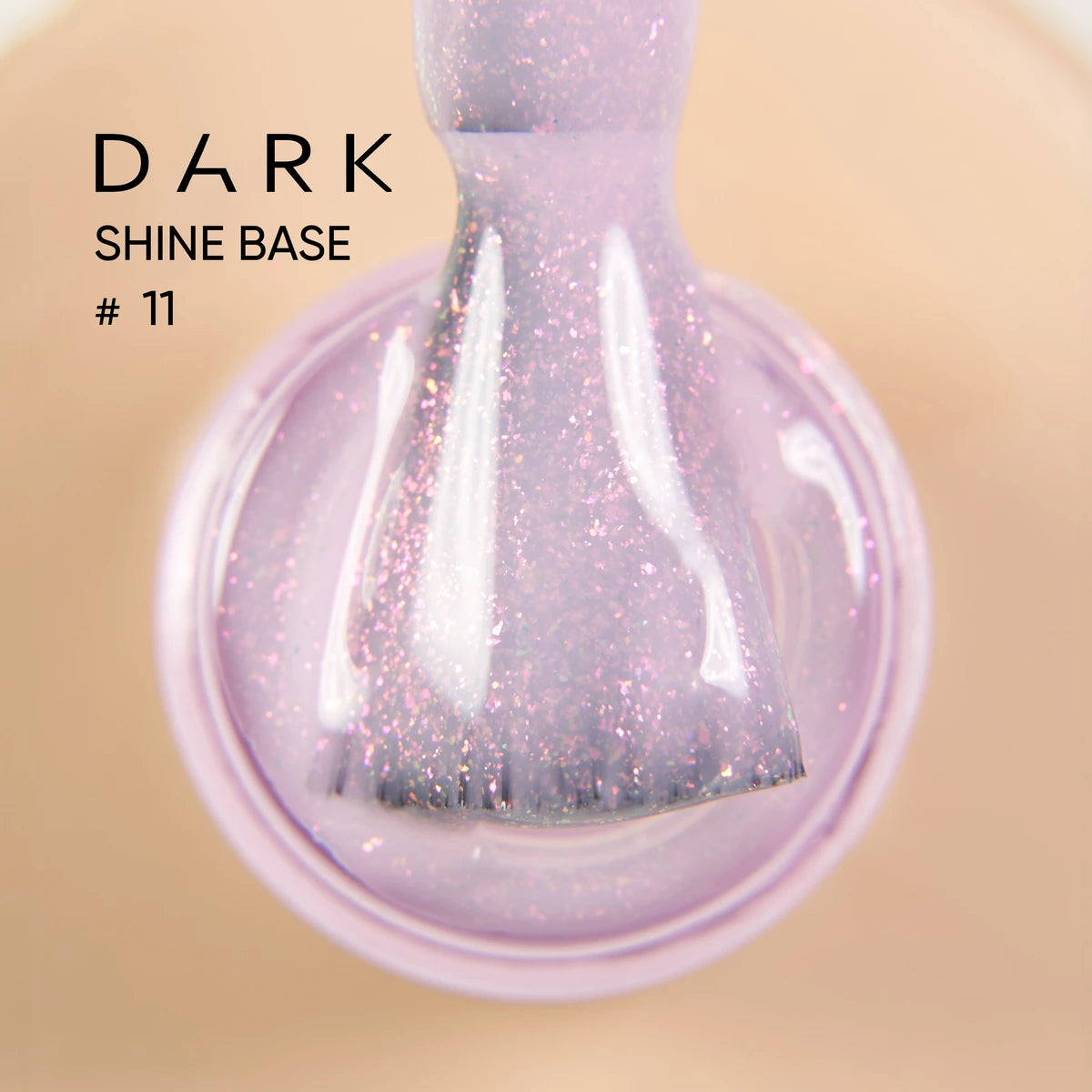 Close-up of brush with shimmery purple nail gel polish, Dark Shine Base #11