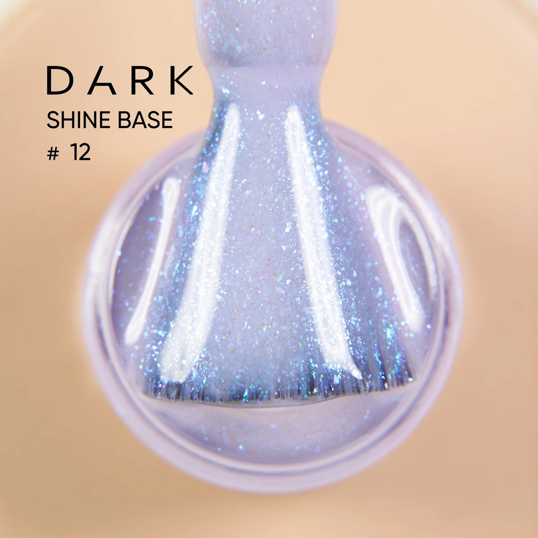 Close-up of iridescent purple glitter gel nail polish on a brush, labeled Dark Shine Base 