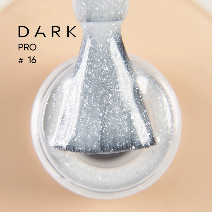 Silver glitter nail polish brush in bottle, close-up, professional manicure product
