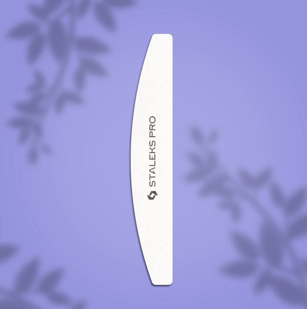 Curved nail file for manicure with STALEKS PRO text on purple background