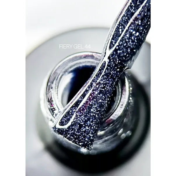 Close-up of brush with sparkly black gel nail polish above open bottle, labeled Fiery Gel 44.