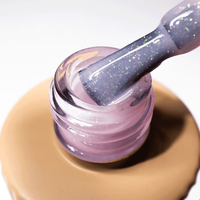 Glitter purple UV gel nail polish with brush for manicure and nail art