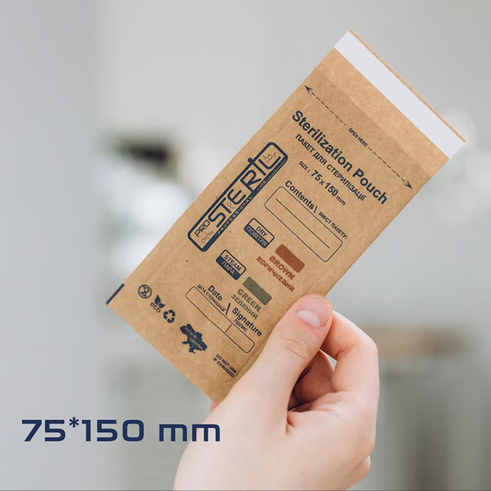 Hand holding 75x150mm sterilization pouch for manicure and pedicure tools