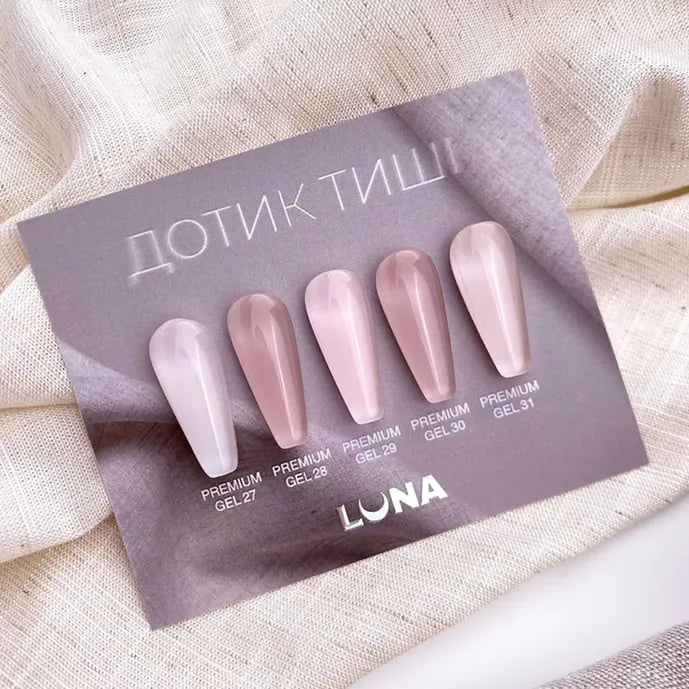 Set of nail samples on a Luna branded card with beige background