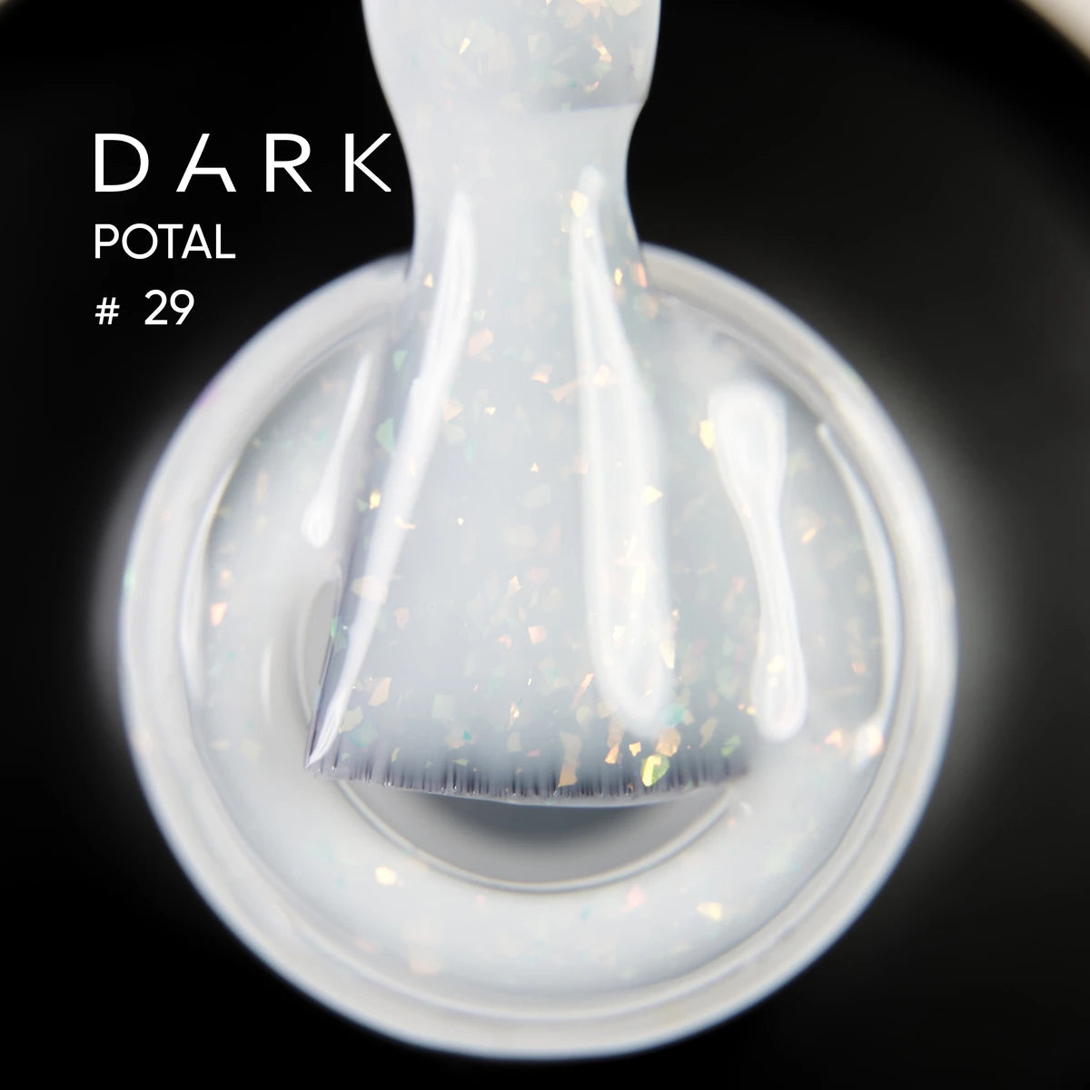 Close-up of iridescent white gel nail polish on brush, labeled Dark Potal 29