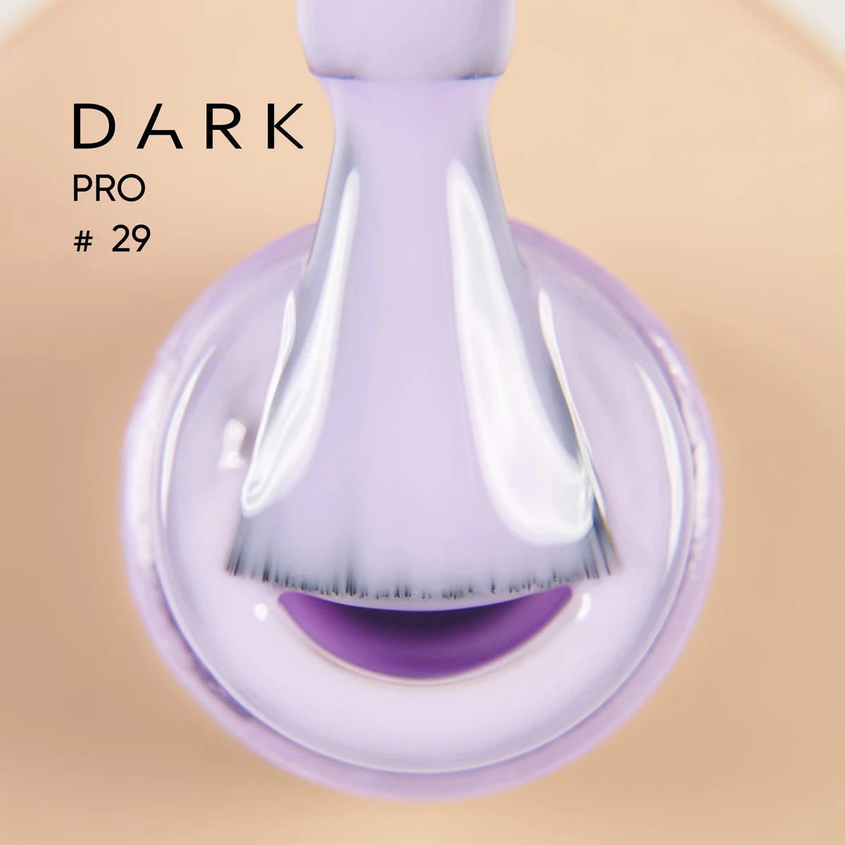 Close-up of a nail polish brush with glossy light purple gel polish, labeled Dark Pro #29.
