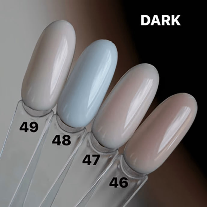 Four dark gel nail polish swatches in neutral tones, labeled 46 to 49, on display sticks.