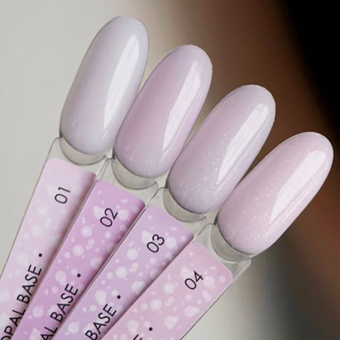Four nail polish swatches in pastel purple shades with subtle shimmer, labeled 01-04.
