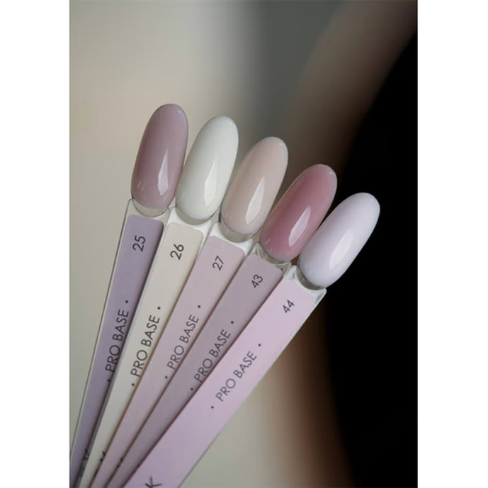 Set of five nail color sample sticks showing neutral gel polish shades for manicure