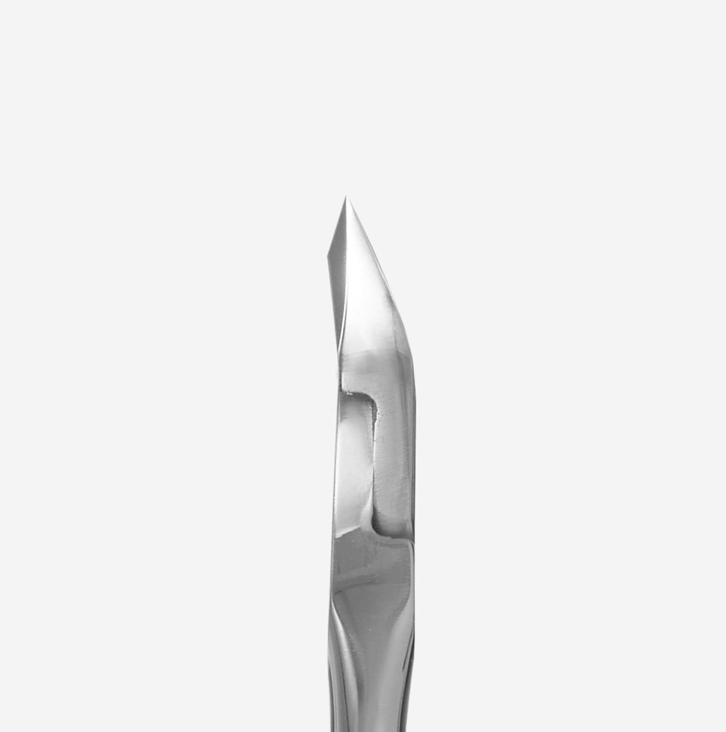 Stainless steel manicure cuticle pusher tool on white background, professional nail accessory