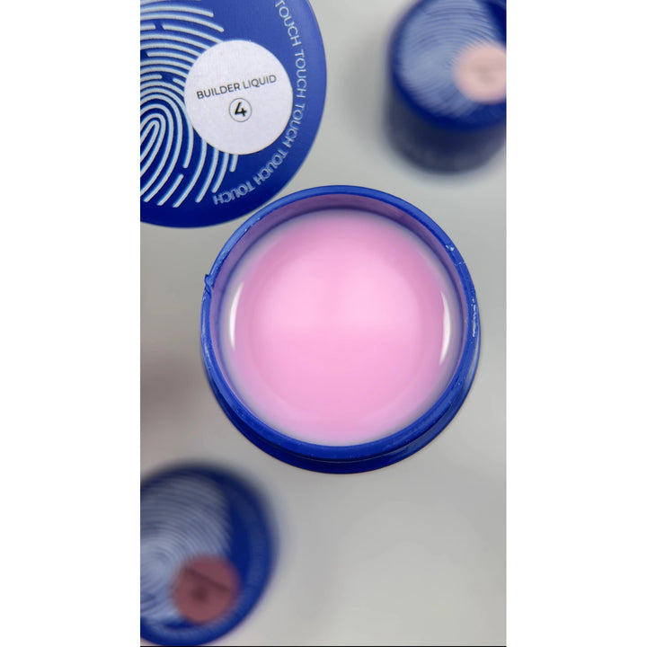Open jar of pink builder gel for nails in a blue container, overhead view