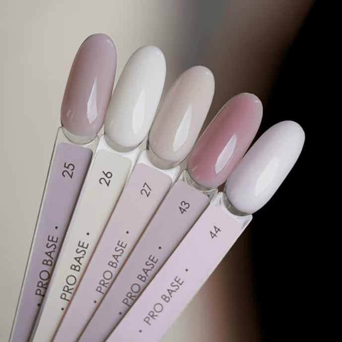 Sample swatches of nude and pastel gel nail polish for manicure, labeled Pro Base shade 25 to 44