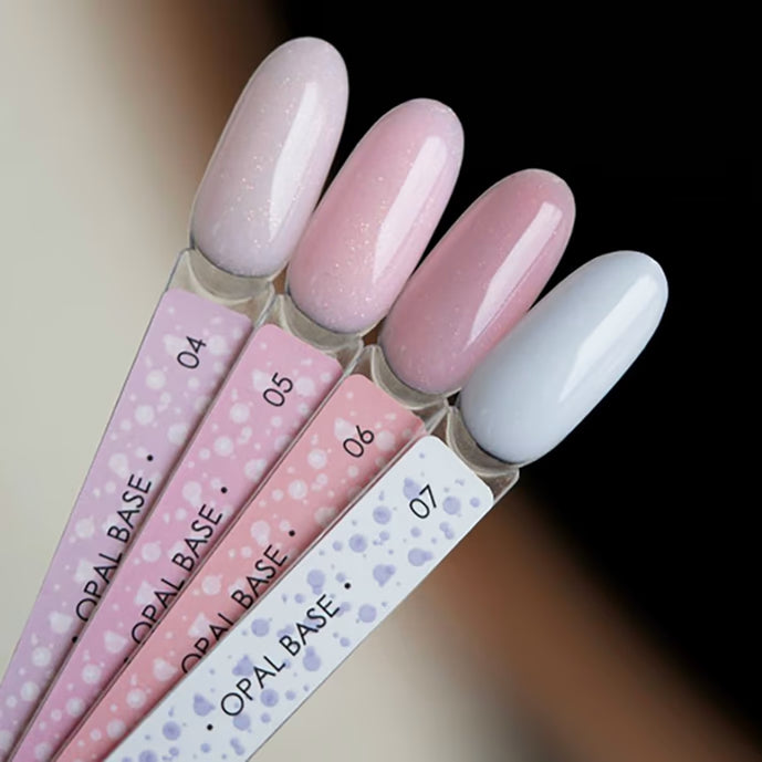 Opal base UV gel nail polish color samples in pastel pink and white shades for manicure