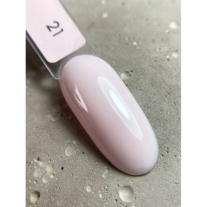 Pale pink UV gel nail polish swatch on a display stick, shade number 21