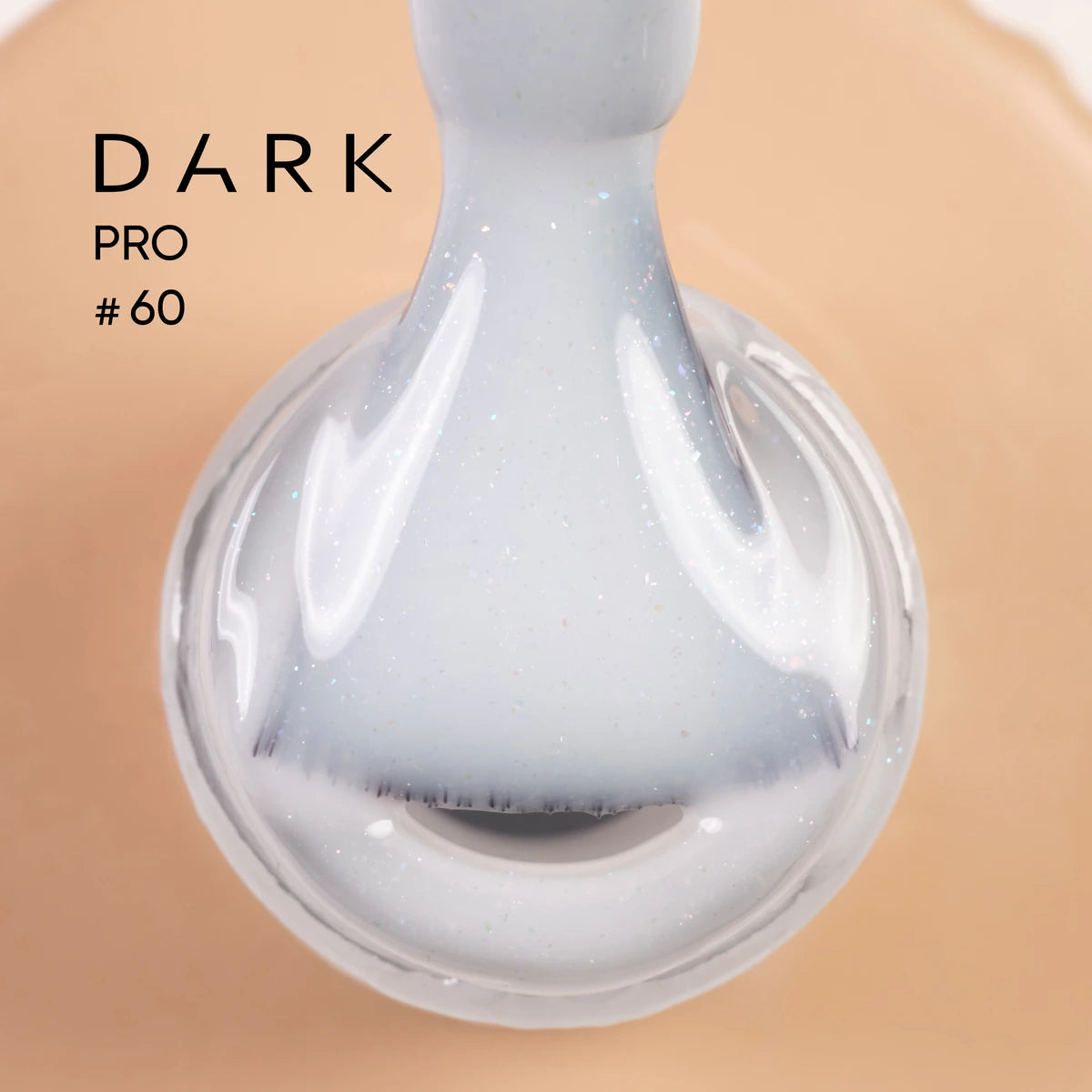 Close-up of a soft white UV gel nail polish with shimmer, labeled Dark Pro #60.