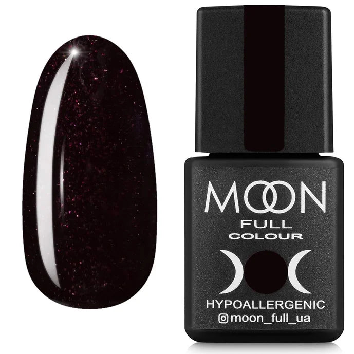 Chocolate with shimmer nail polish bottle with a dark glittery nail next to it on a white background