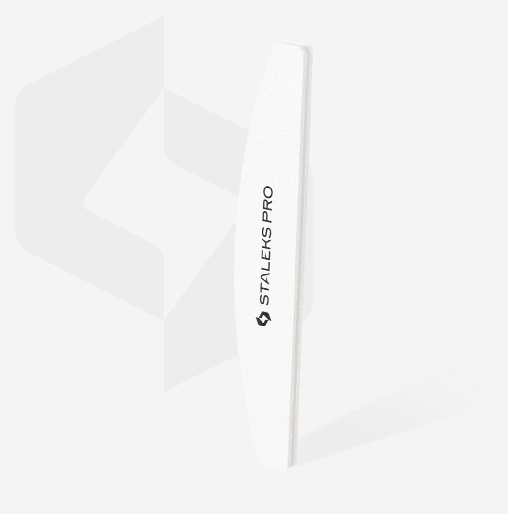 White curved nail file for professional manicure, labeled Staleks Pro, on light background