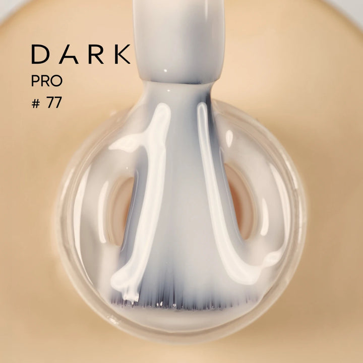 Beige gel nail polish brush applicator close-up, labeled DARK PRO 