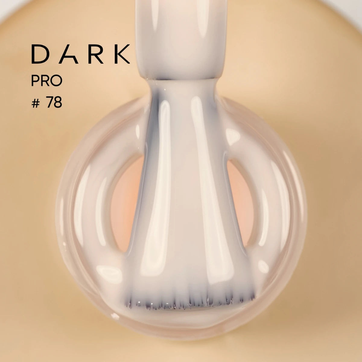 Nail polish brush with creamy beige UV gel polish, labeled Dark Pro #78, close-up view
