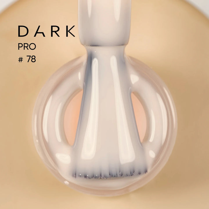 Nail polish brush with creamy beige UV gel polish, labeled Dark Pro 