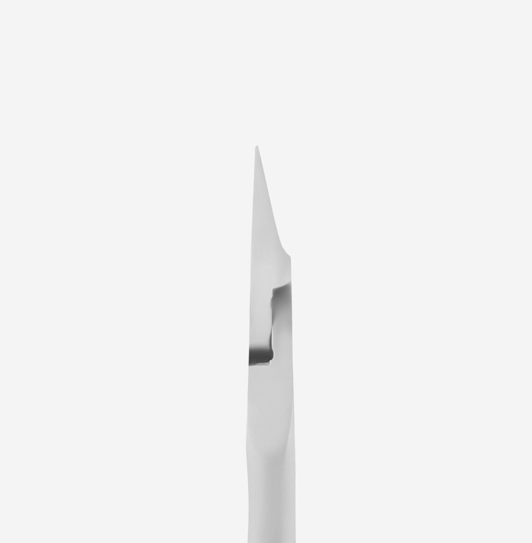 Close-up of stainless steel nail cuticle pusher tool on white background