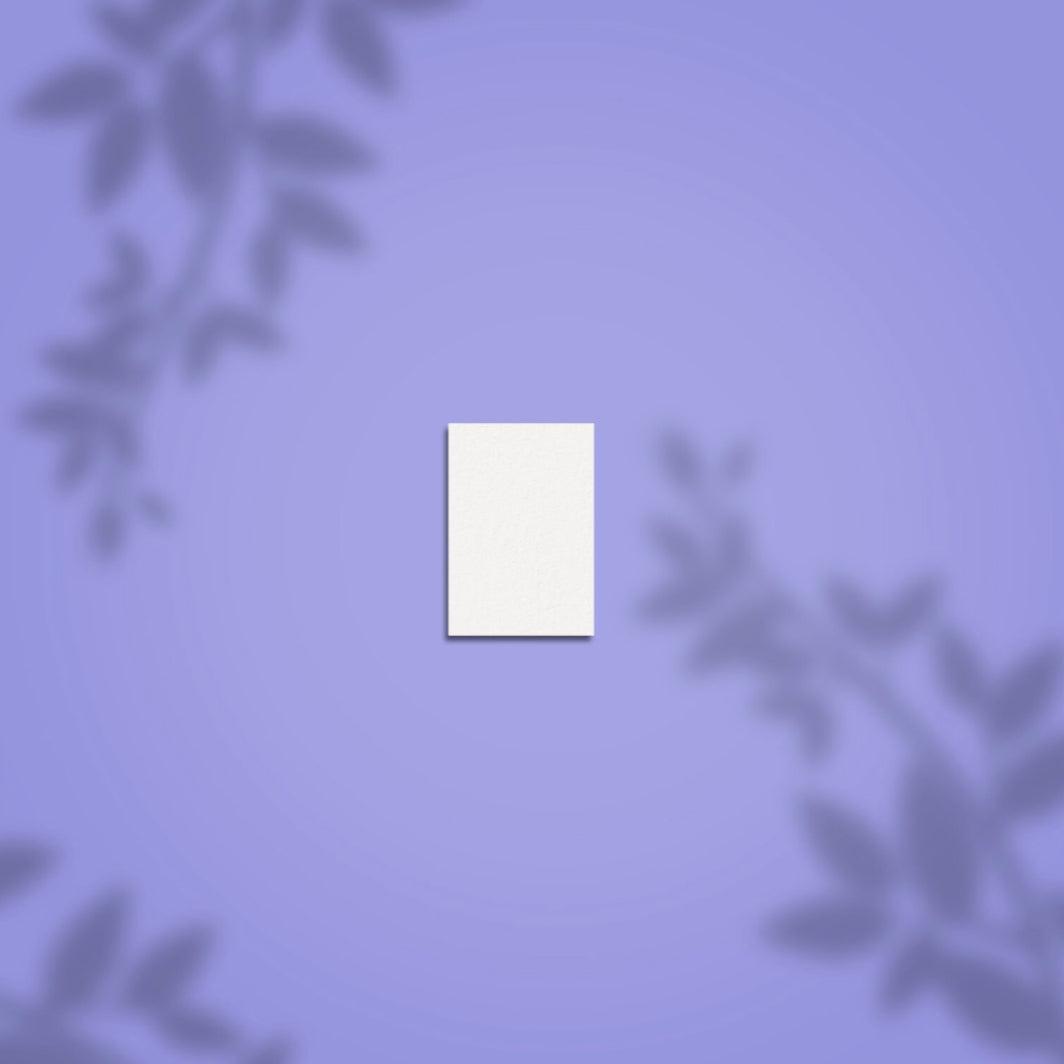 White nail art buffer on purple background with leaf shadows, manicure accessory