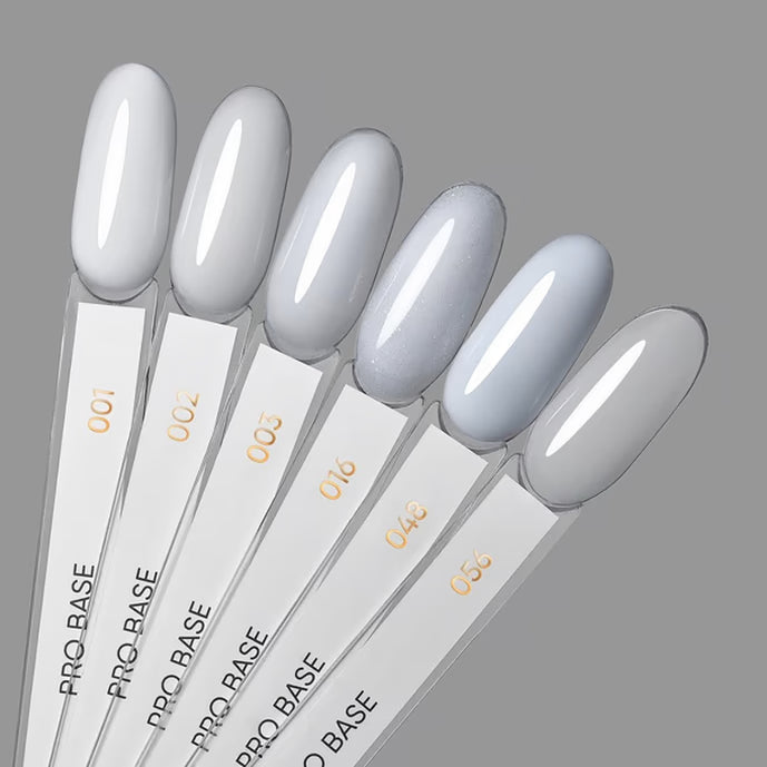 Set of six neutral grey gel nail polish samples on labeled swatch sticks for manicures