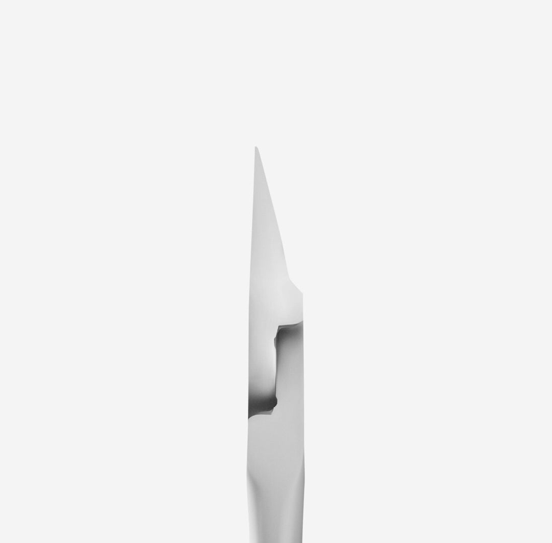 Close-up of stainless steel nail tool tip for manicure and pedicure on white background