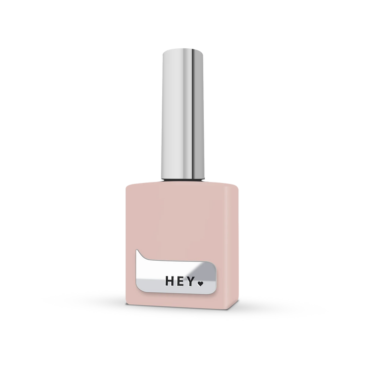 Light pink nail polish bottle with silver cap and &