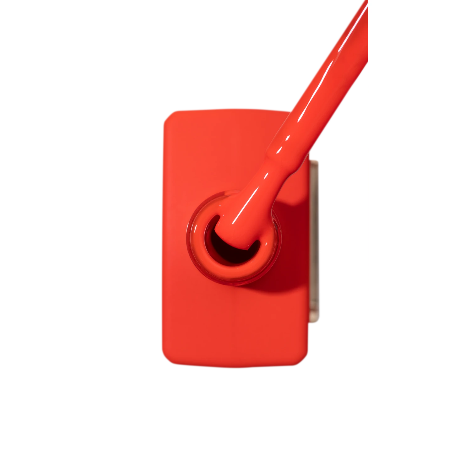 Bright red gel nail polish bottle with brush, professional manicure accessory