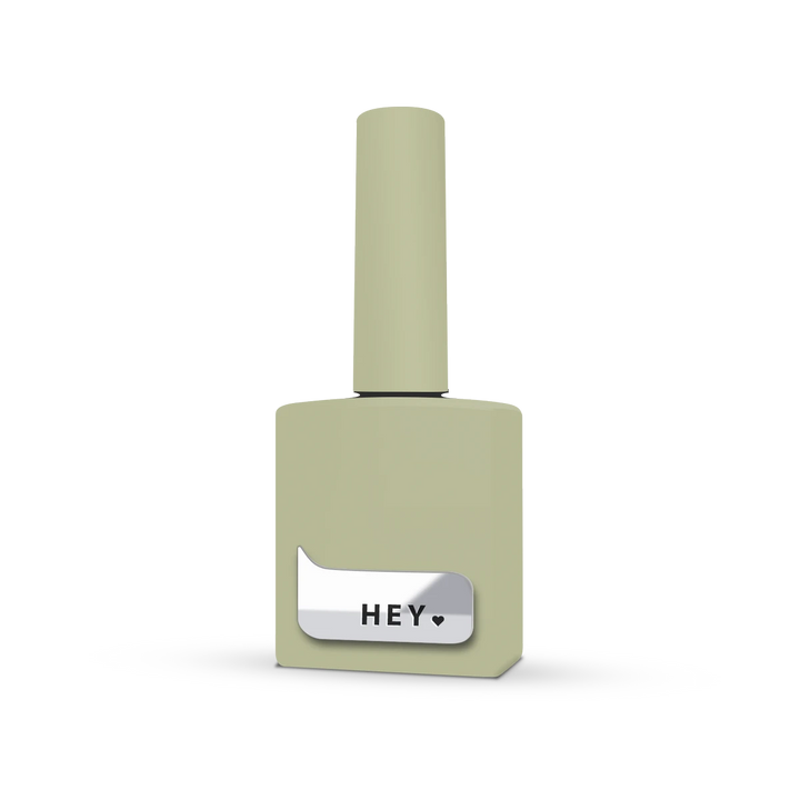 Pale green UV gel nail polish bottle with HEY label for manicure