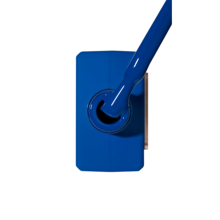 Vibrant blue gel nail polish with brush, professional manicure product