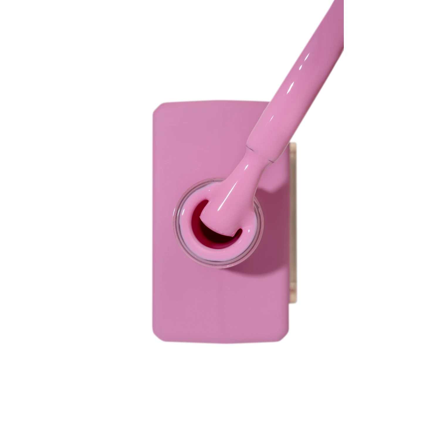 Pink gel nail polish bottle with brush, professional manicure accessory